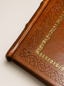 The Phoenix and the Carpet - Genuine leather binding detail with decorative border tooling